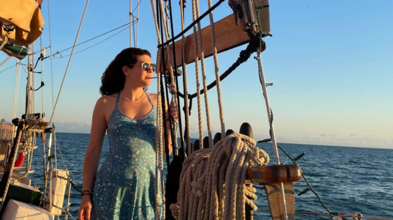 The author Natalie Becerra admiring the view from the Sunset Sail Schooner in Key West