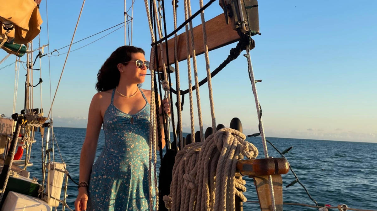 The author Natalie Becerra admiring the view from the Sunset Sail Schooner in Key West