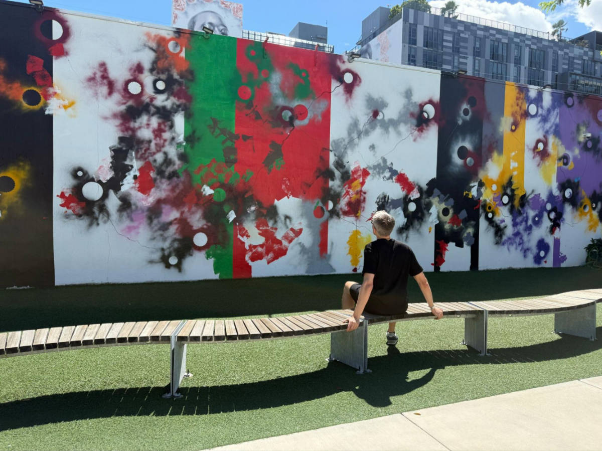 Travel Lemming founder, Nate Hake admiring the colorful Wynwood Walls