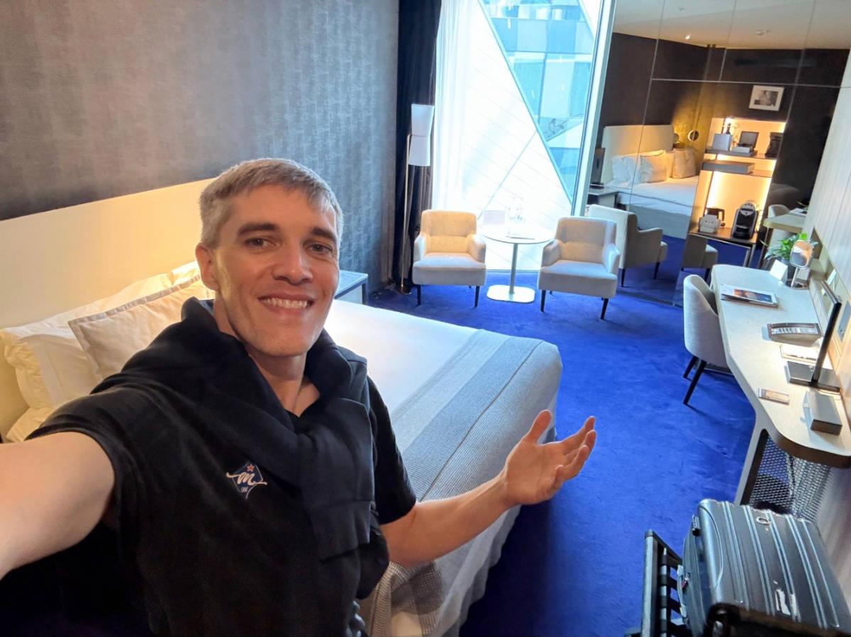 Nate Hake smiling for a selfie on his room at the Anantara-The Marker