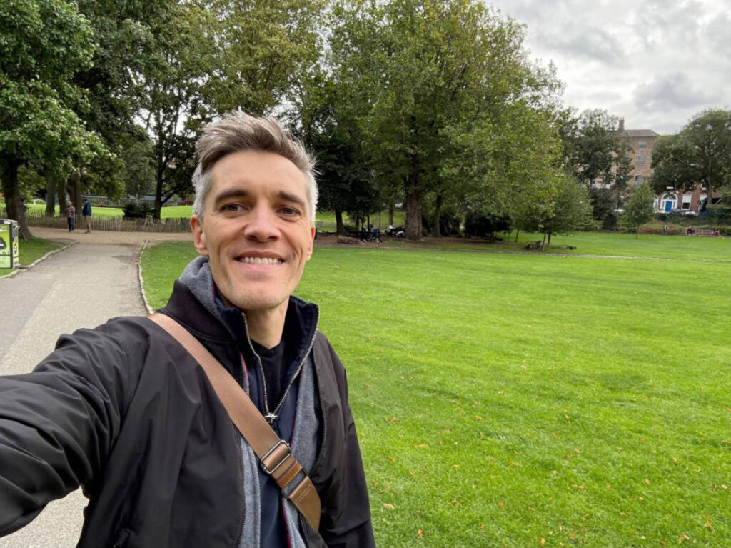 Nate Hake smiling for a selfie at the Merrion Square Park
