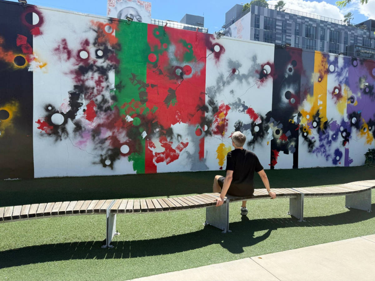 Travel Lemming founder admiring one of the street art in Wynwood Walls