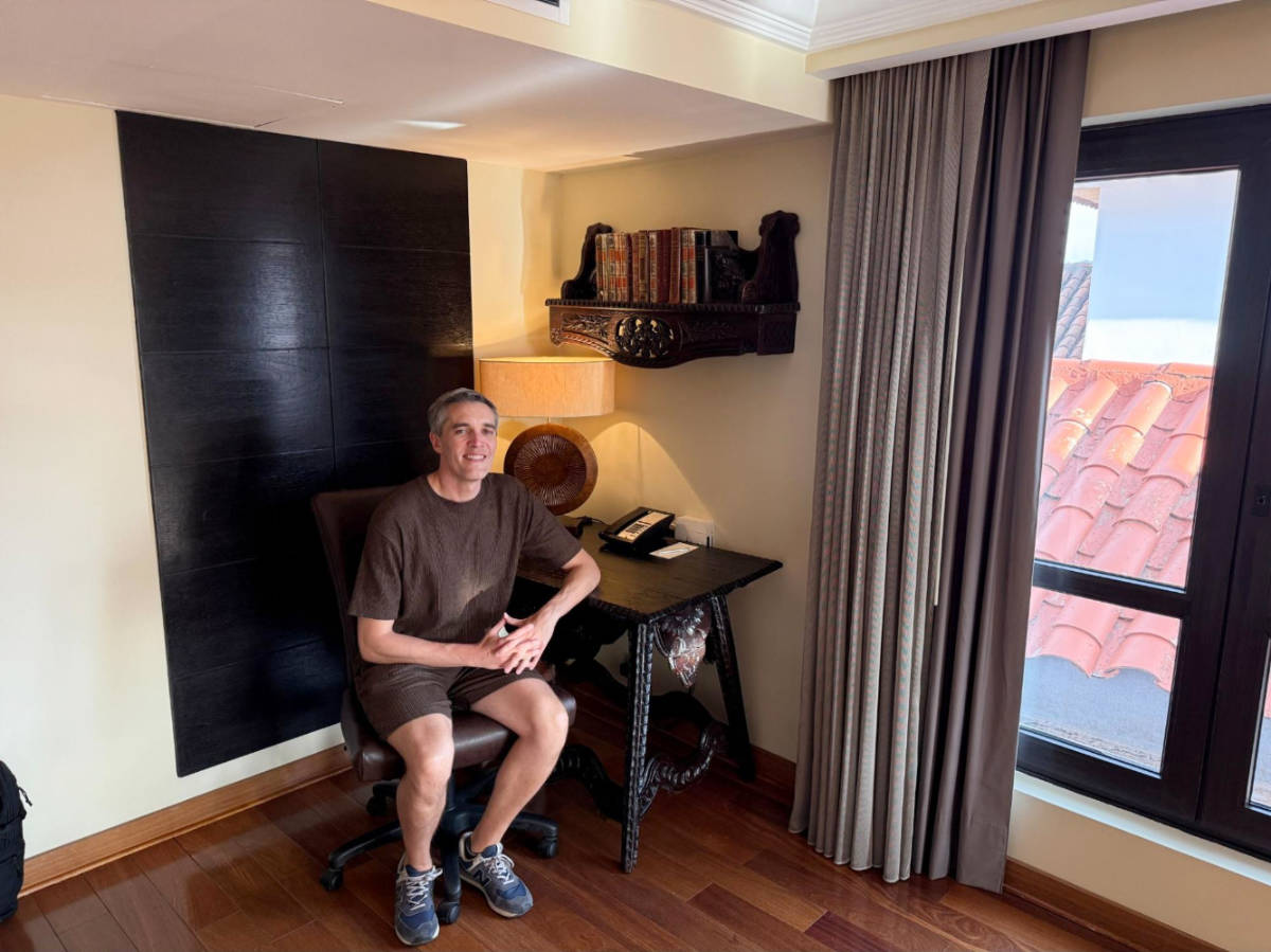 The author, Nate Hake at the desk area on their Imperial Suite in JW Marriott El Convento Cusco