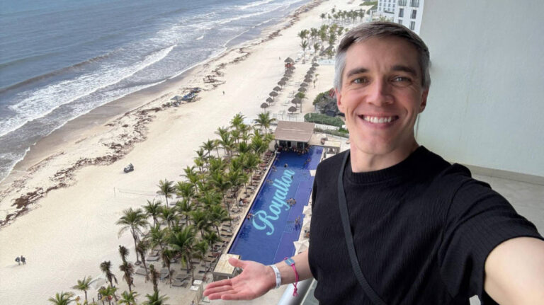 Travel Lemming founder Nate Hake, showing the overlooking view of the pool at Royalton
