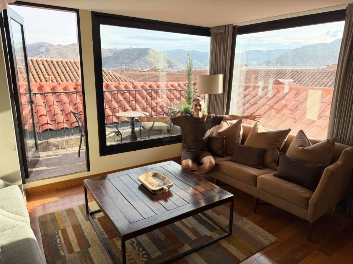 Travel Lemming founder Nate Hake, sitting inside suite at the JW Marriott El Convento Cusco