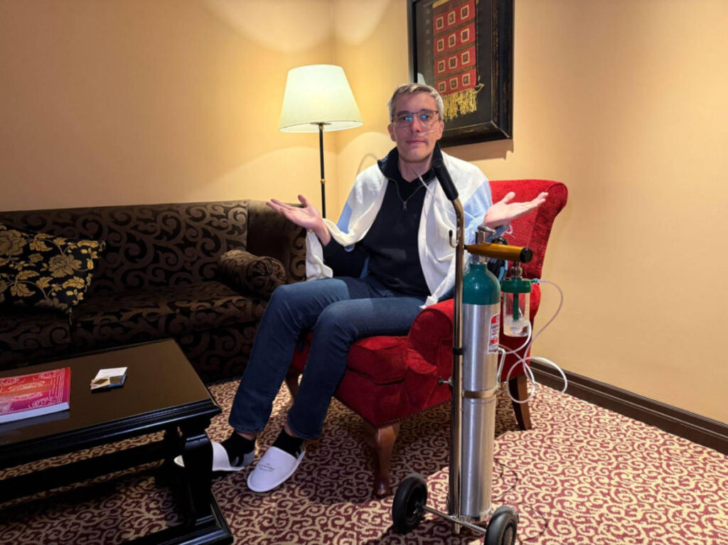 The author Nate Hake, using the oxygen service in the hotel