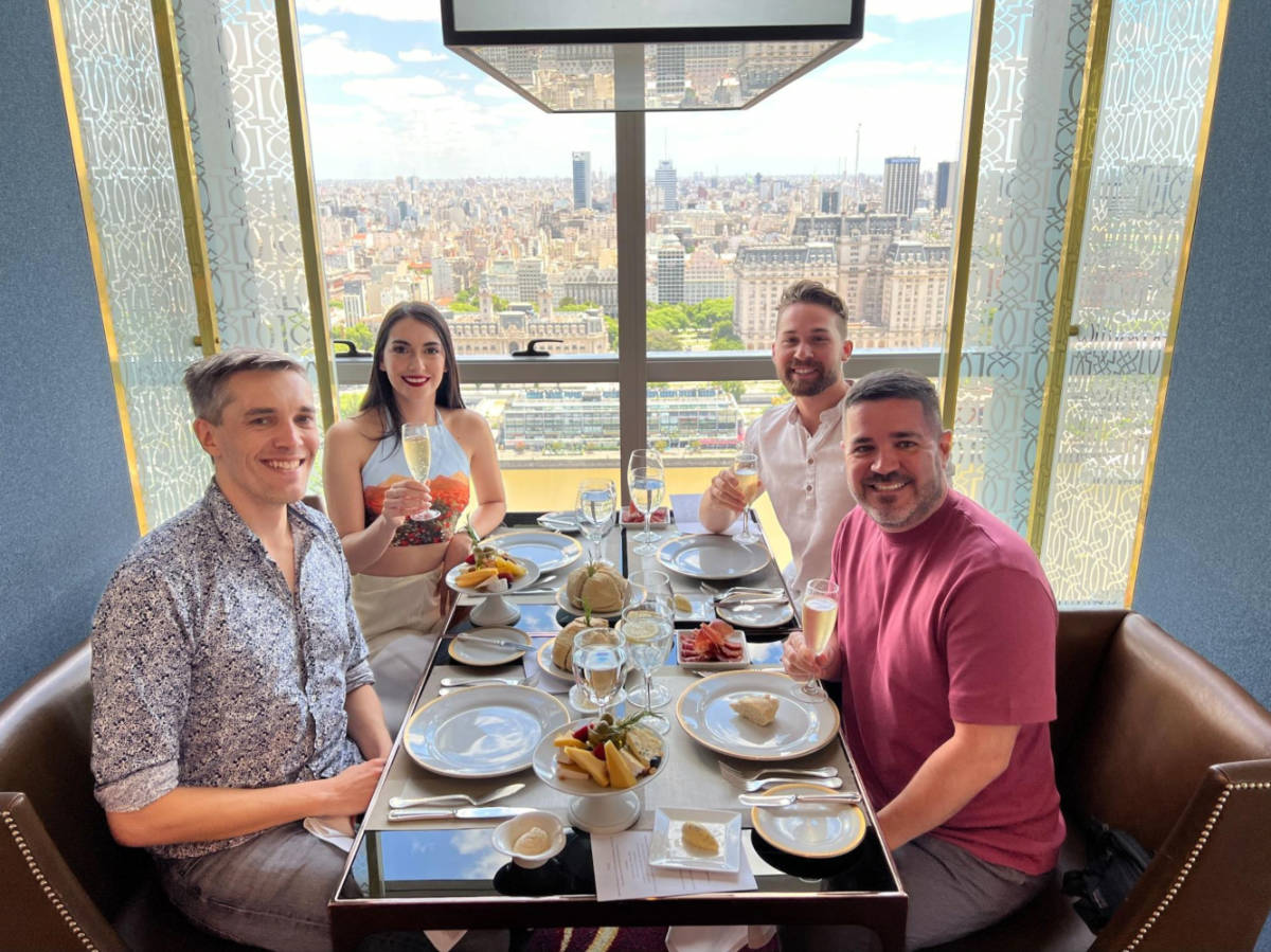 Travel Lemming founder, Nate Hake and Clara Kesseler with their Friends dining on the rooftop restaurant of the Alvear Icon Hotel