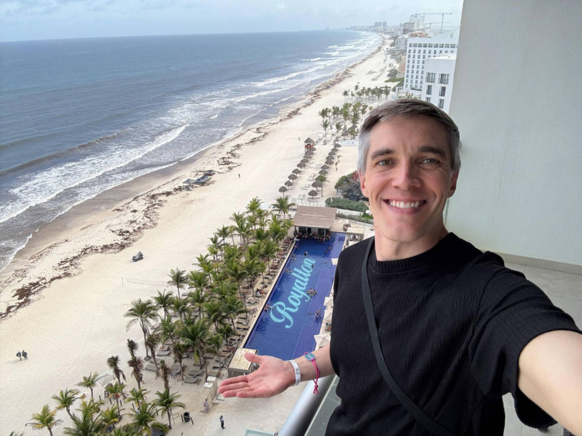 Travel Lemming founder Nate Hake, showing the overlooking view of the pool at Royalton CHIC Adults-Only