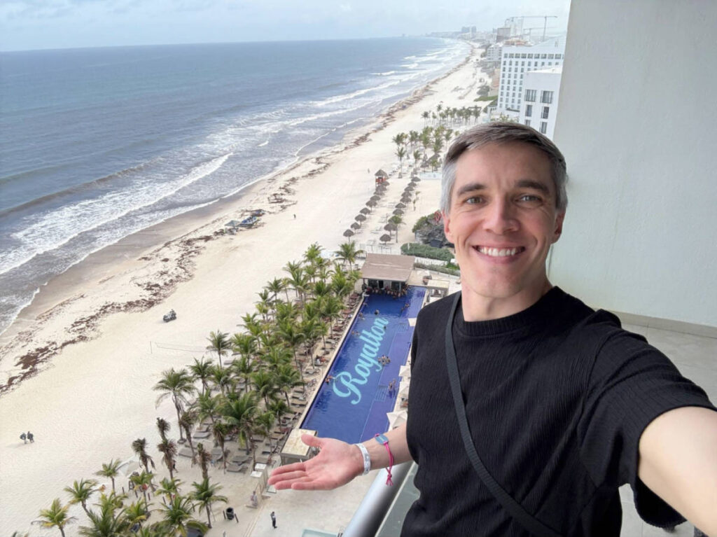 Travel Lemming founder Nate Hake, showing the overlooking view of the pool at Royalton CHIC Cancun