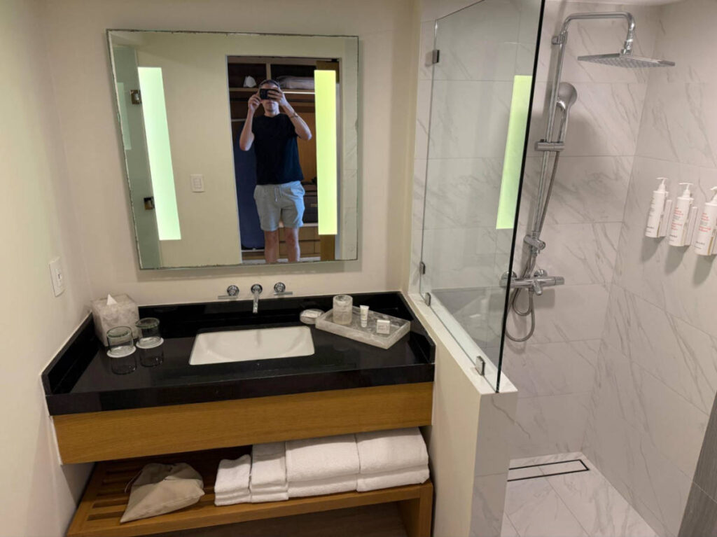 Travel Lemming founder Nate Hake, taking a photo of the sink inside the bathroom of Marriott Cancun