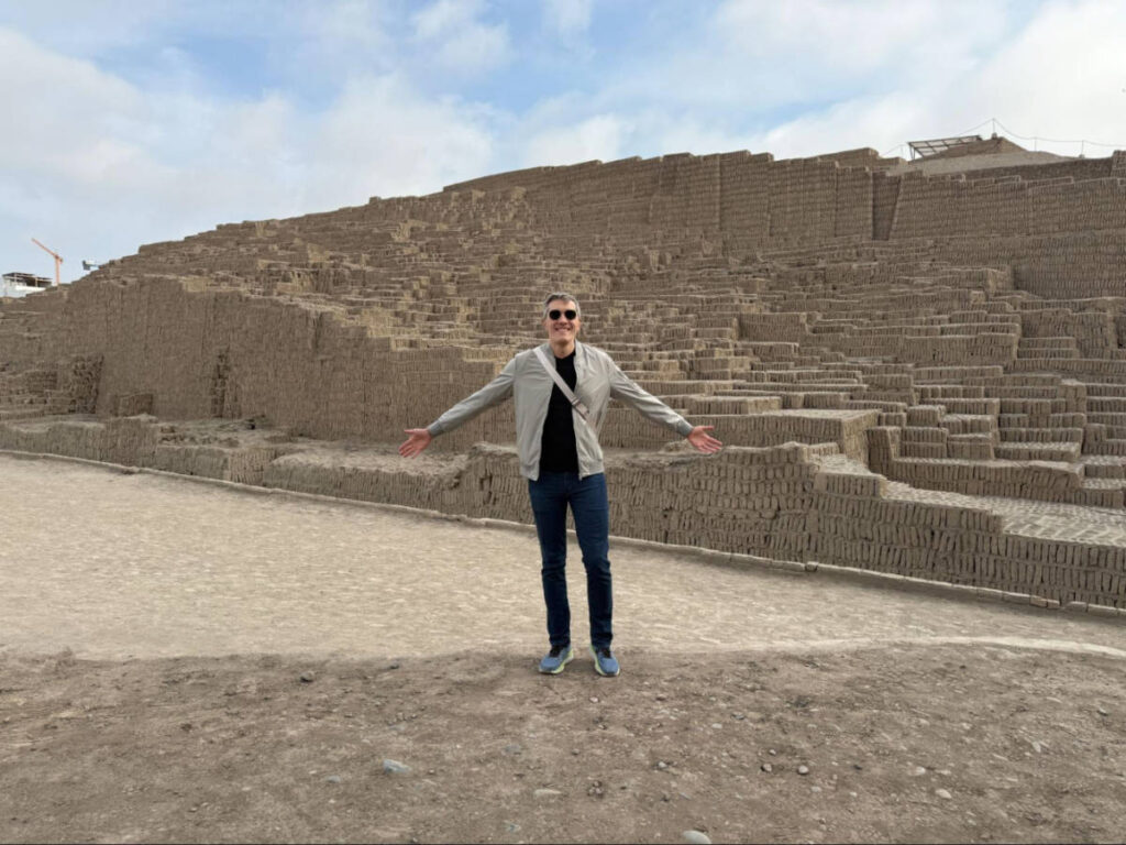 Travel Lemming Founder Nate Hake, standing in front of the Huaca Pucllana adobe pyramid in Miraflores
