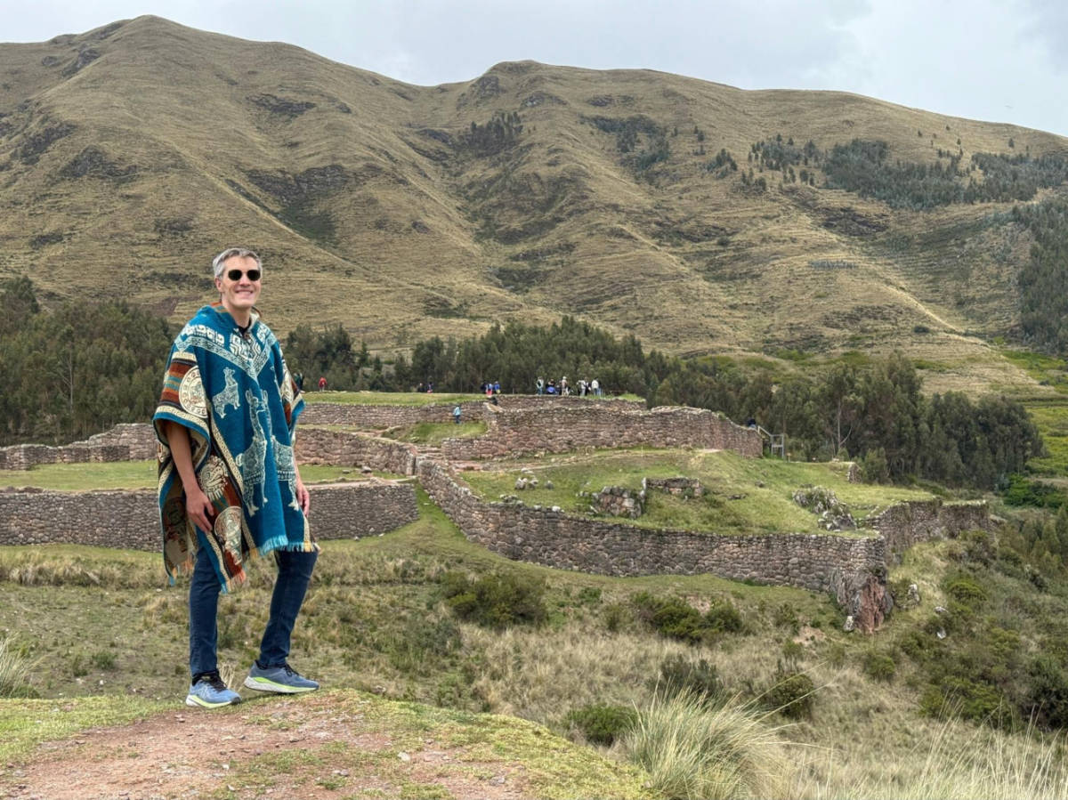 Travel Lemming founder Nate Hake, posing for a photo in front of the Puka Pukara Archaeological Complex