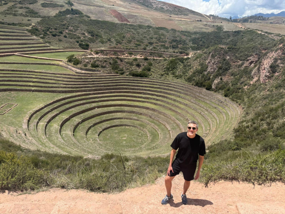 Travel Lemming founder Nate Hake, standing atop the Ancient Ruins of Moray