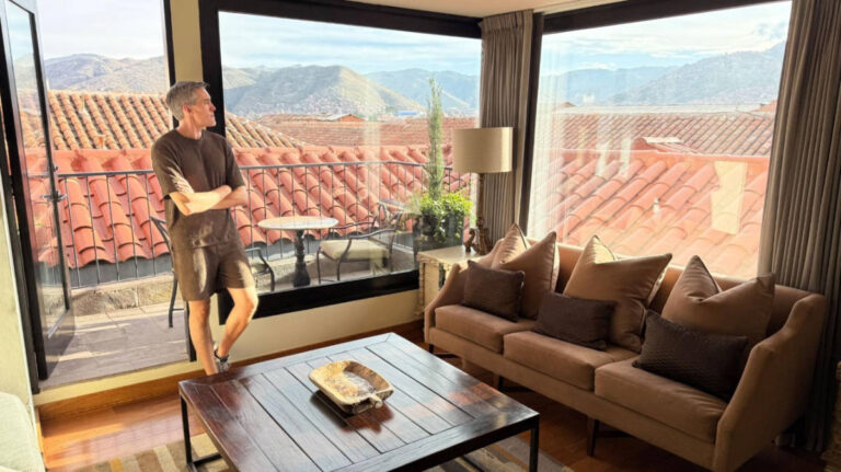 Travel Lemming founder Nate Hake, posing for a photo while admiring the view from the Imperial Suite of the JW Marriott El Convento Cusco