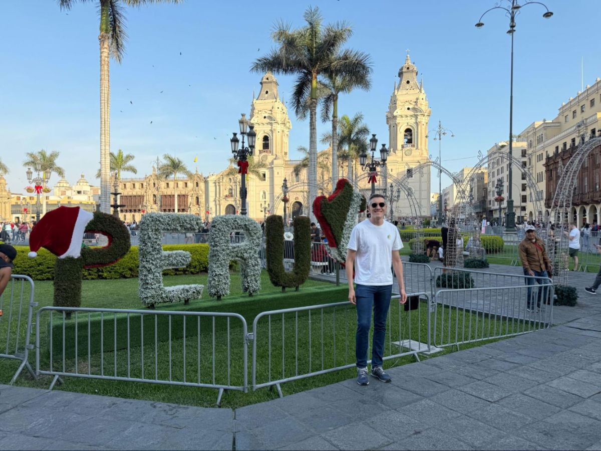Author Nate in Plaza Mayor with Lima Cathedral in the background