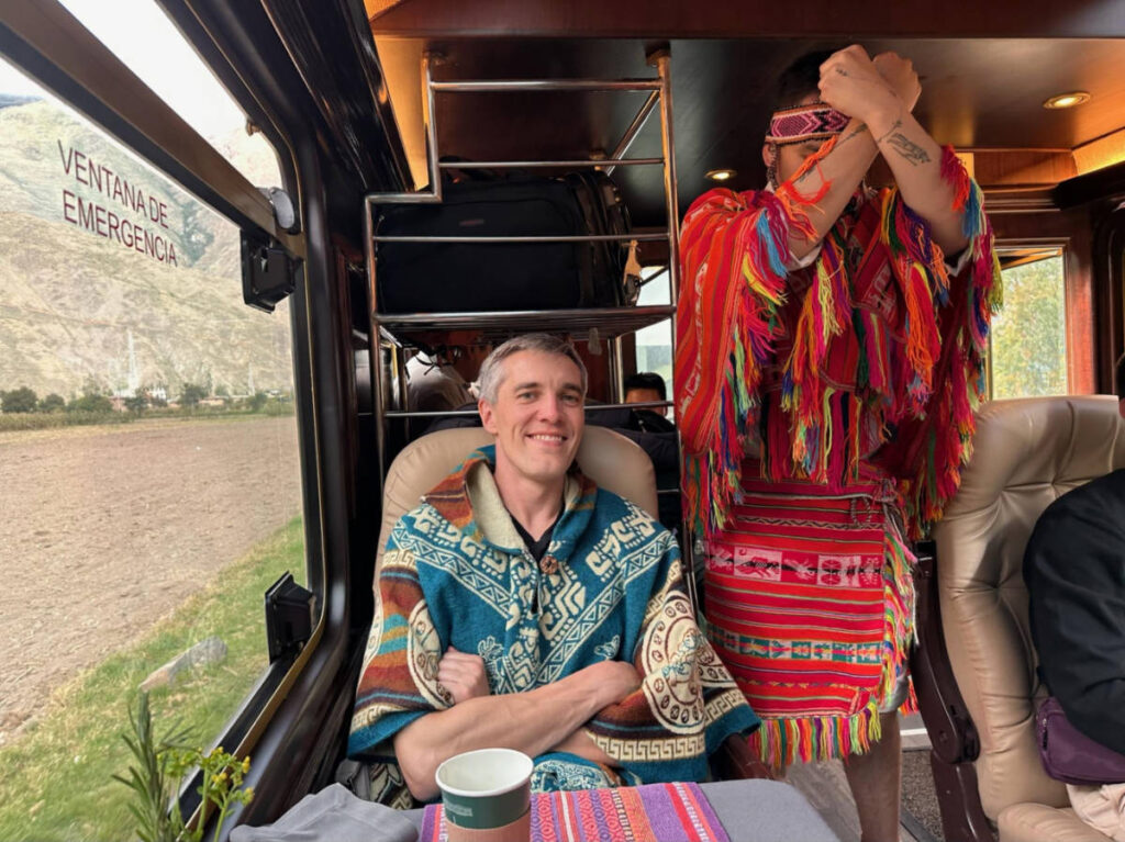 Travel Lemming founder Nate Hake, smiling inside the Inca Rail’s “Prime” Train