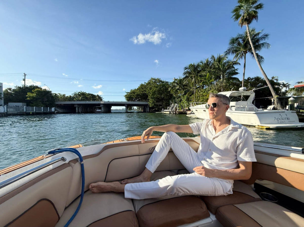 Travel Lemming founder, Nate Hake sitting comfortably on the boat tour in Miami