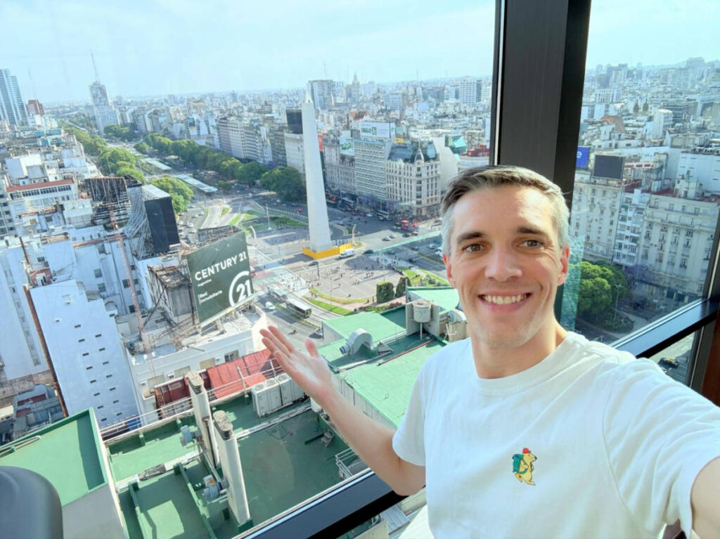 Travel Lemming founder, Nate Hake, showing the overlooking view of the Obelisk from the rooftop of the Buenos Aires Marriott