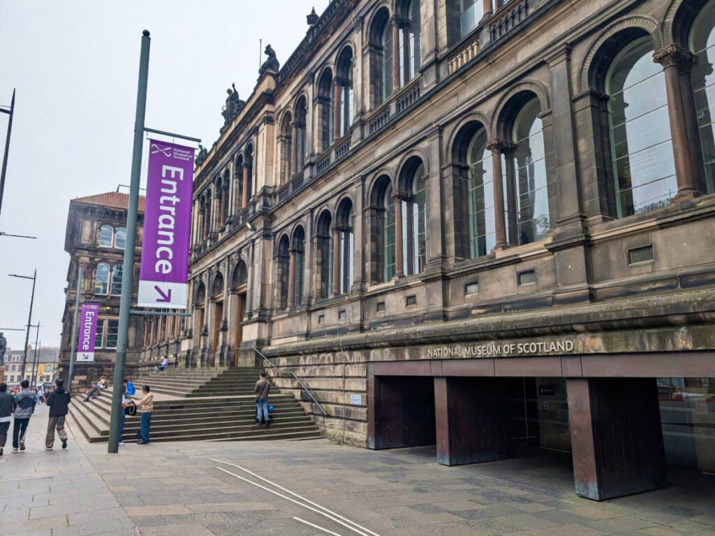 View of the building and entrance signages outside the National Museum of Scotland