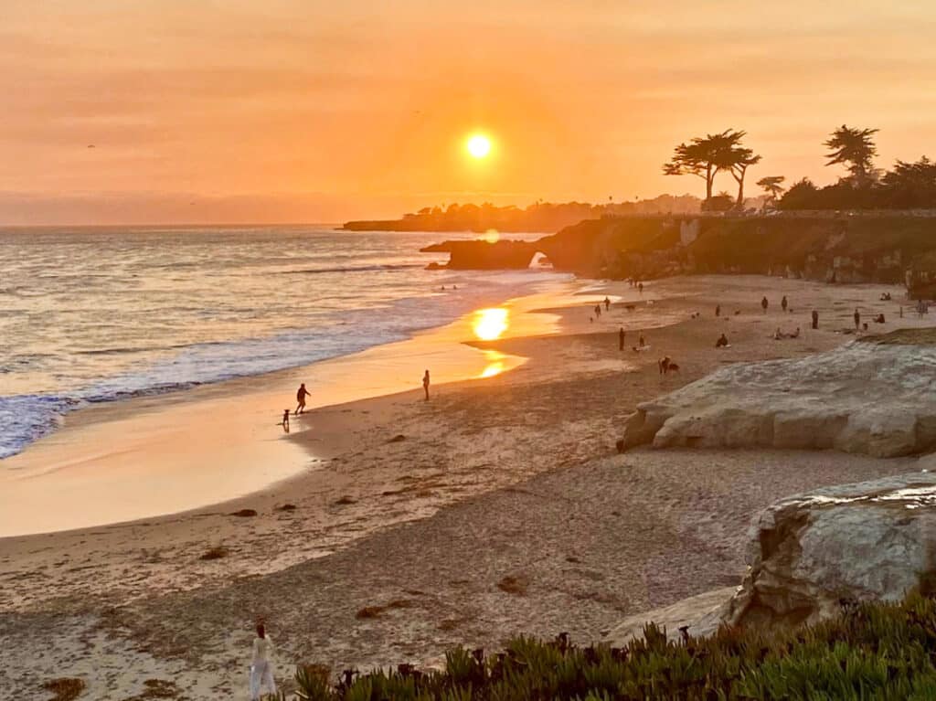 Picturesque view of the sunset at the Natural Bridges State Beach