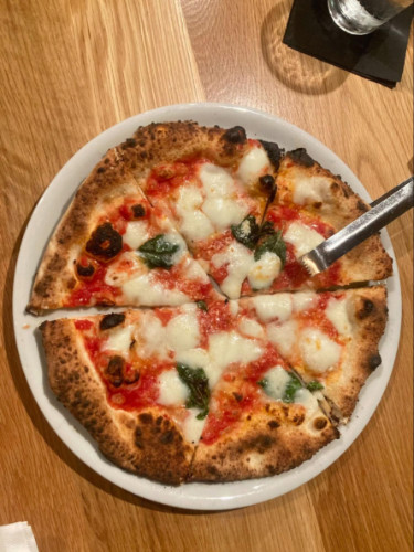 A Neapolitan pizza served at Marco’s Coal Fired