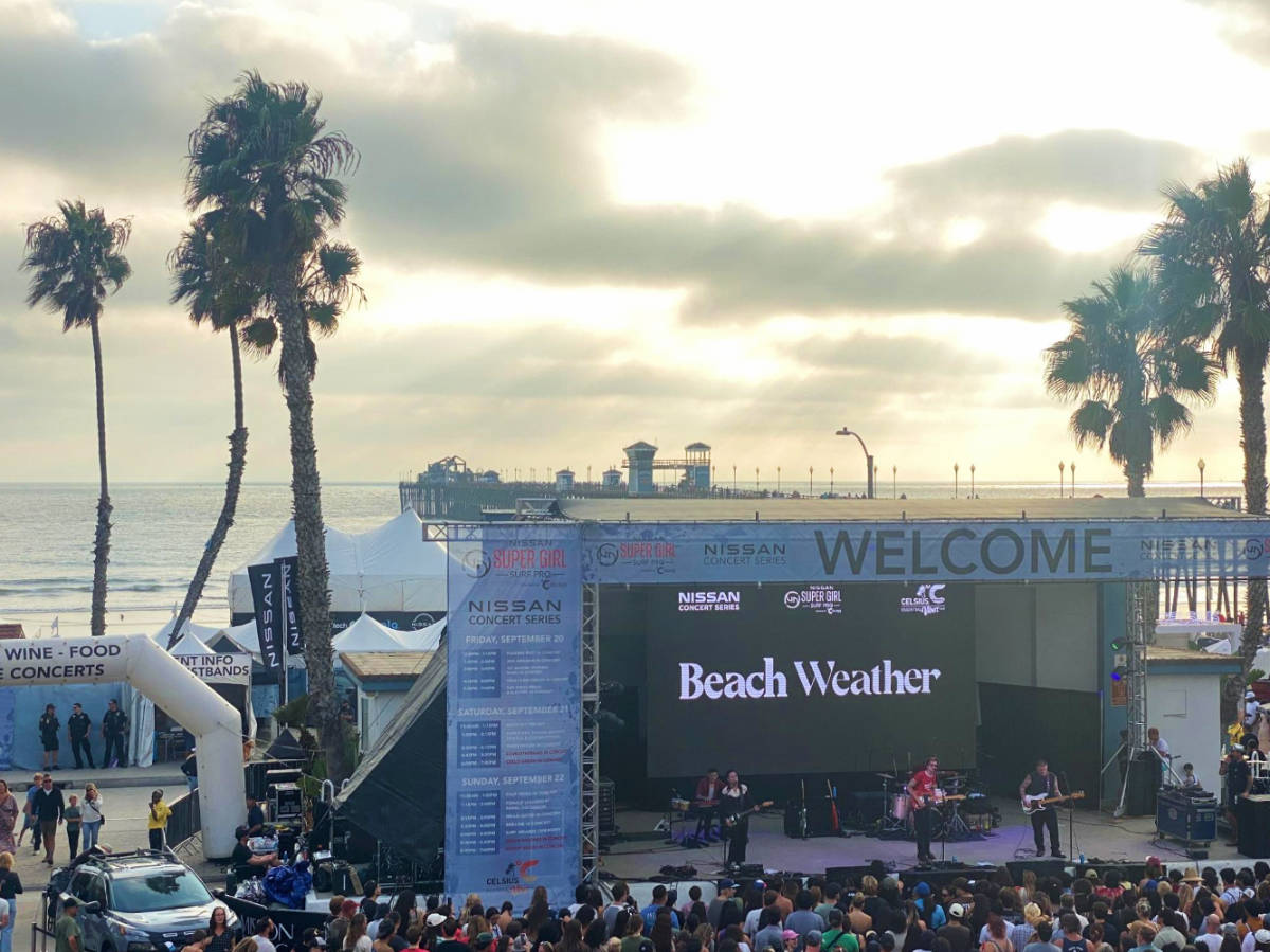Performers on stage during a free concert at the Nissan Super Girl Surf Pro