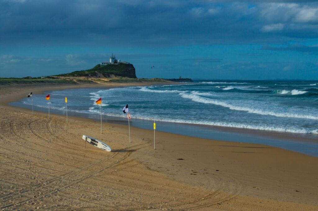 Nobbys beach with Newcastle Lighthouse in the distance