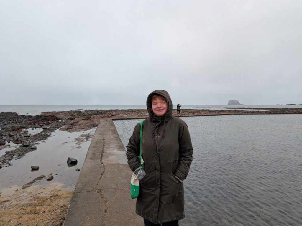 The author Louise Wylie during a stormy day at North Berwick Beach