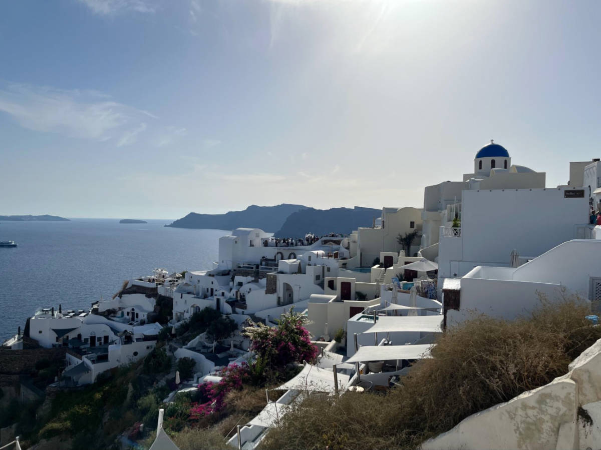 View of the whitewashed cave houses and domes in Oia