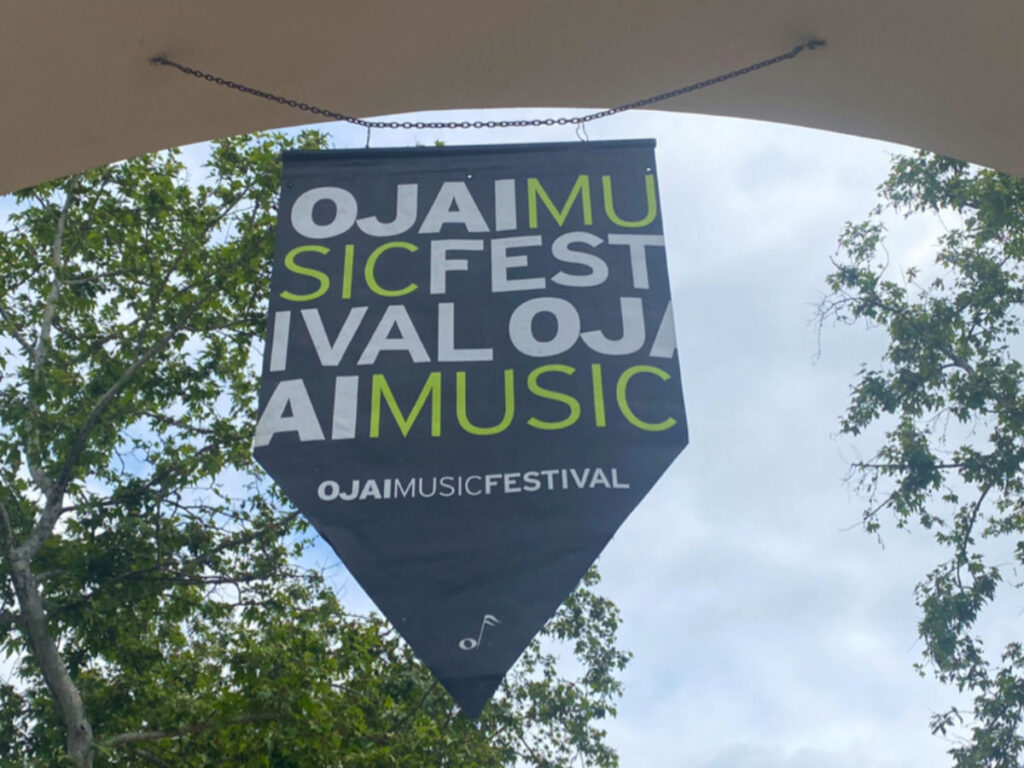 A hanging signage of the of the Ojai Music Festival