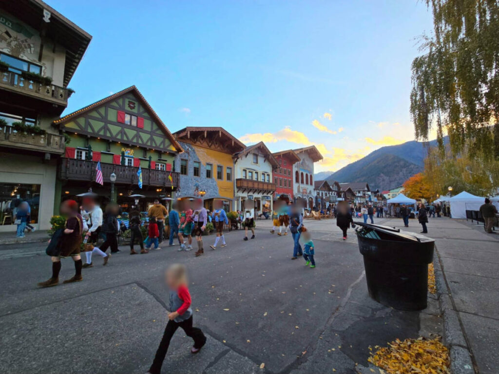 People wearing lederhosen and other traditional Bavarian attire during the Oktoberfest in Leavenworth