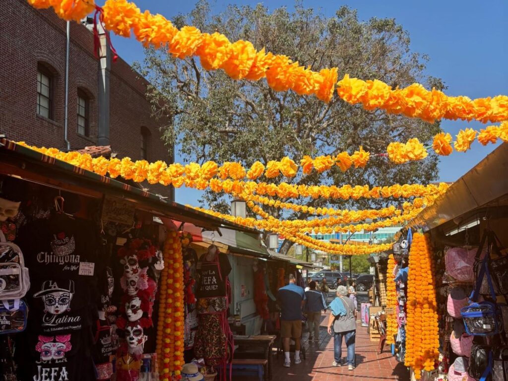 View of Marigold garlands above the shops on Olvera Street