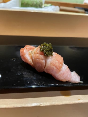 A small bite on a plate in Omakase