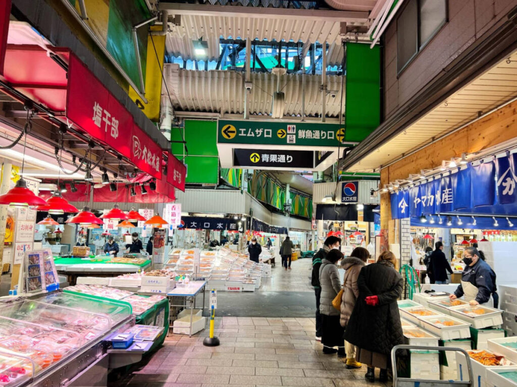 People looking around at the displays in Omicho Market