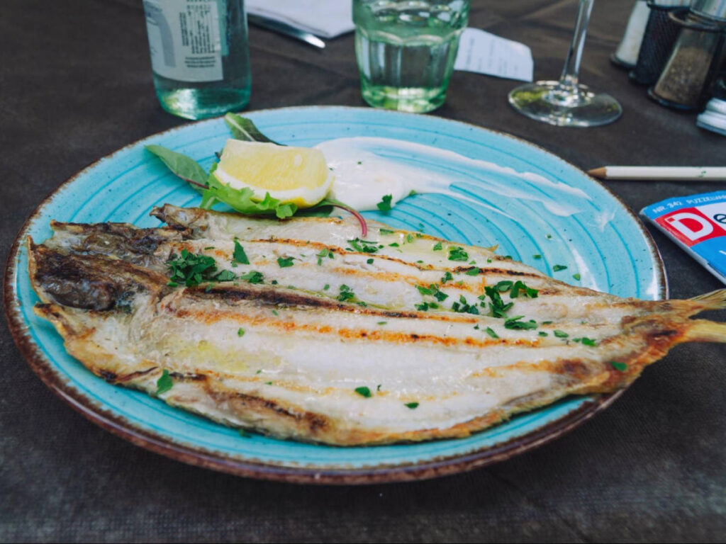 A fish on a plate served in Osteria Rivelin