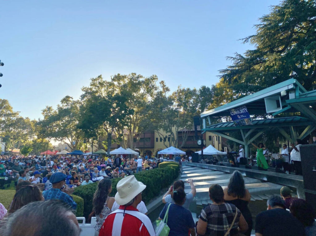 View of the crowd watching the free outdoor concert in Downtown Concord’s Todos Santos Park