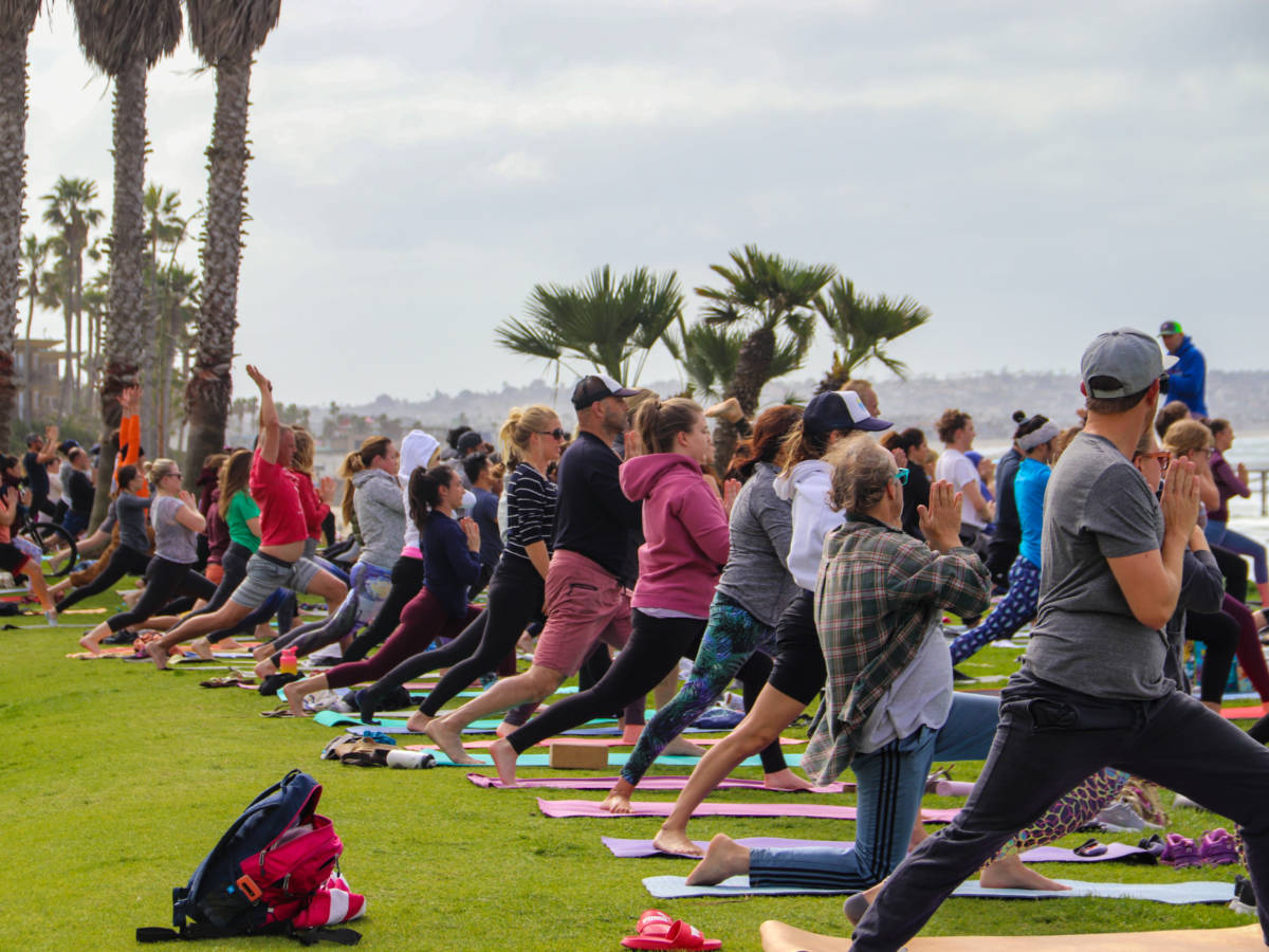 People doing yoga in Pacific Beach park overlooking the ocean