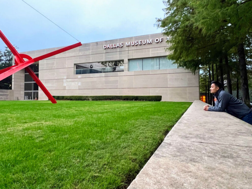 Author Sarah Heath's partner in front of Dallas Museum of Art