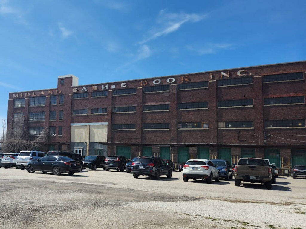 Exterior view of the Midland Arts & Antiques Market seen from the parking area
