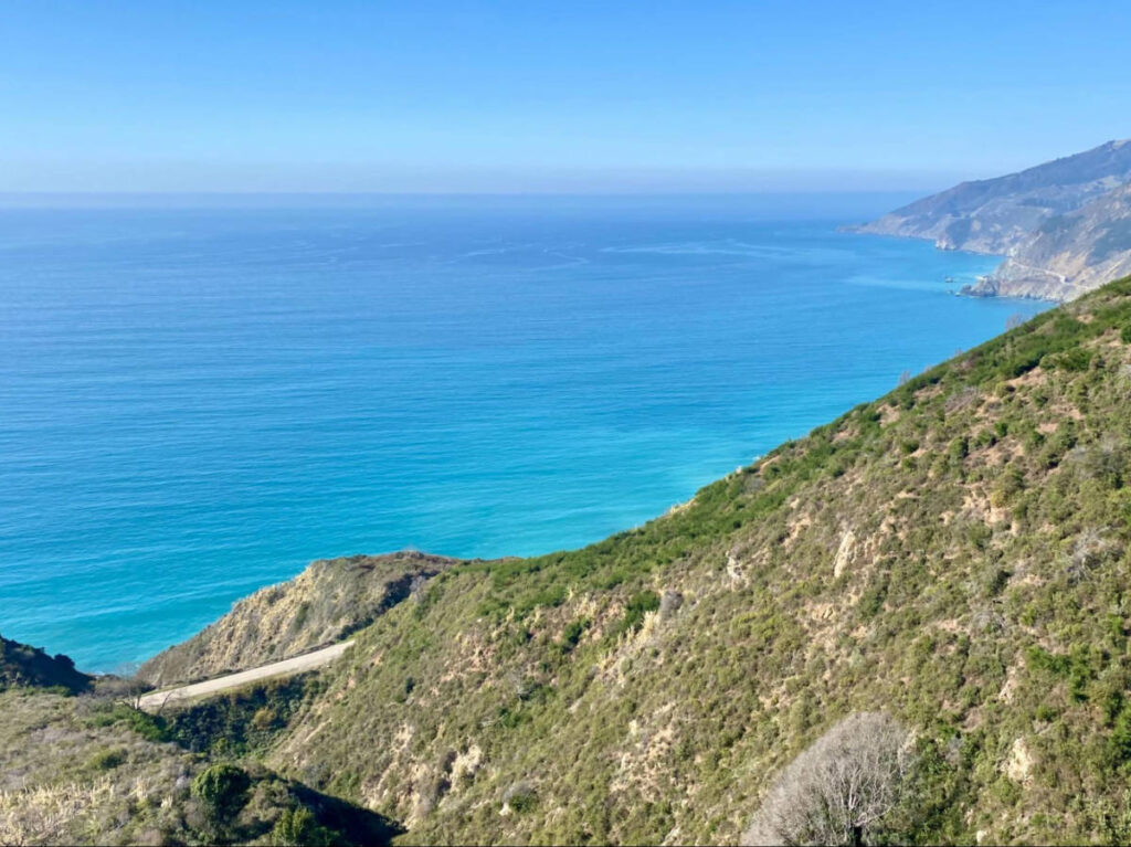 Overlooking view of the Highway 1 and turquoise water from the hills
