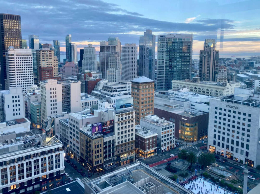 Overlooking view of the city skyline of Union Square seen from the rooftop bar at sunset