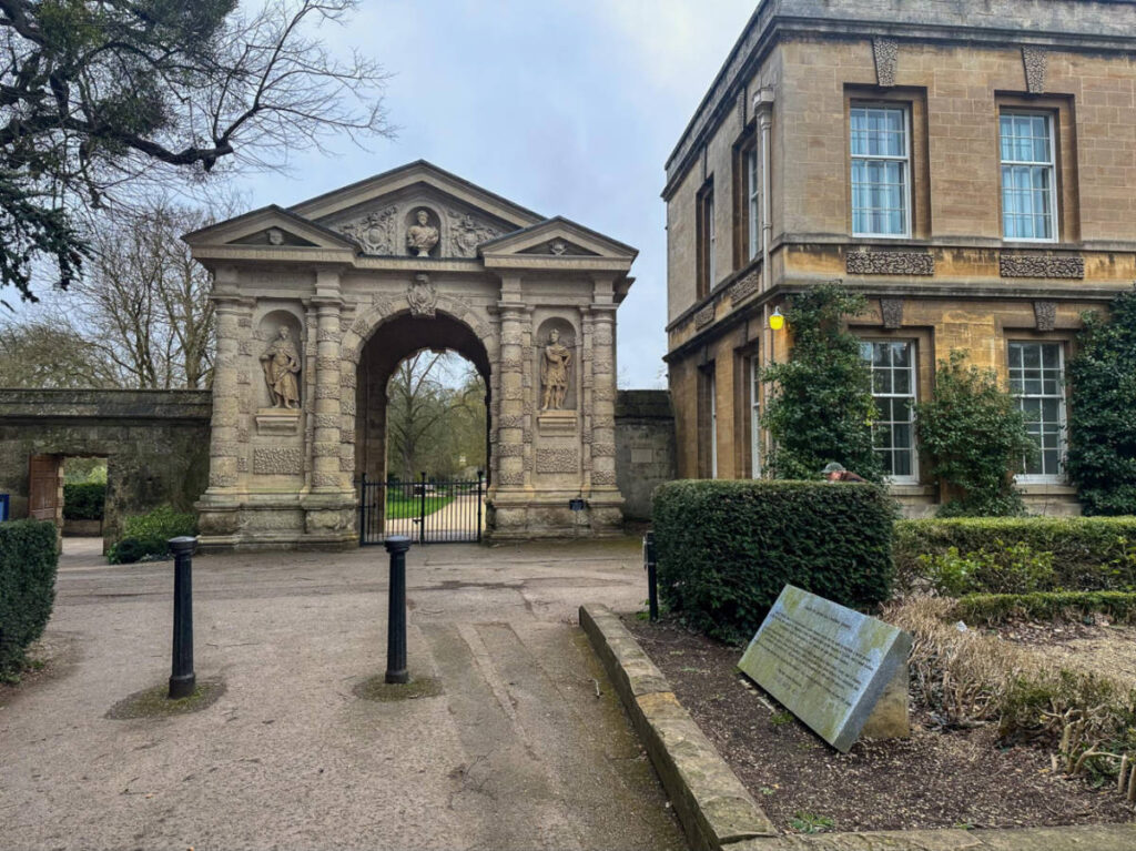 View of the archway and landscape of Oxford Botanic Garden