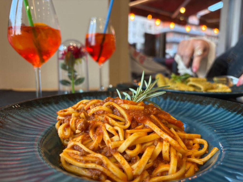Closeup look of the plate with red pasta from PASTA & PIZZA