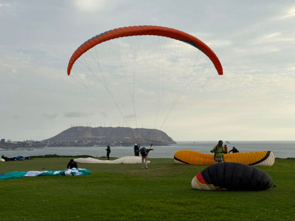 Paragliders setting up their equipment in Miraflores