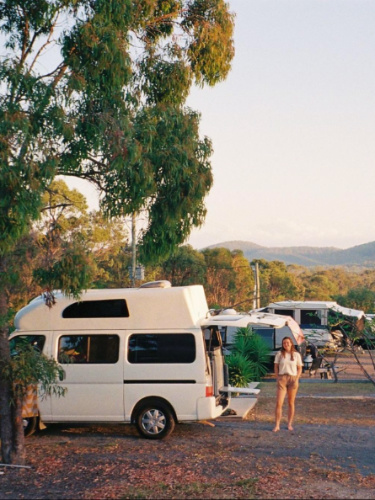 Author Laura posing near the campervan at their campsite