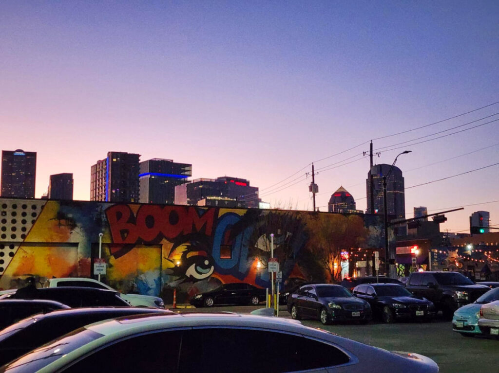 Street art and skyline views from a parking lot in Deep Ellum