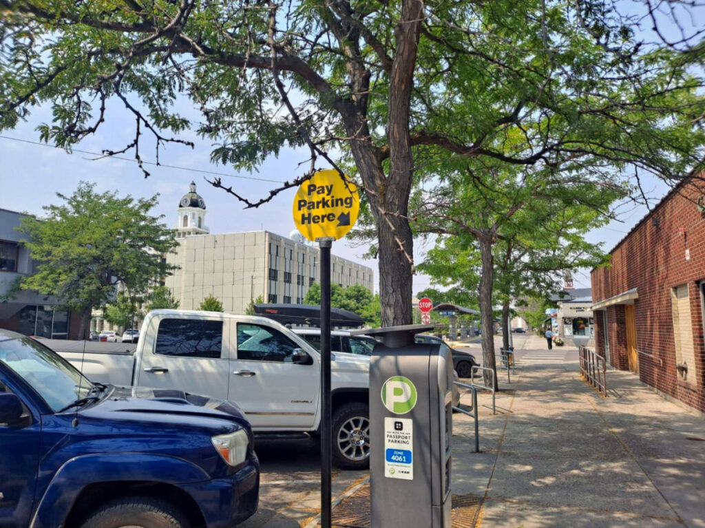 Parking meters and sign in downtown Missoula