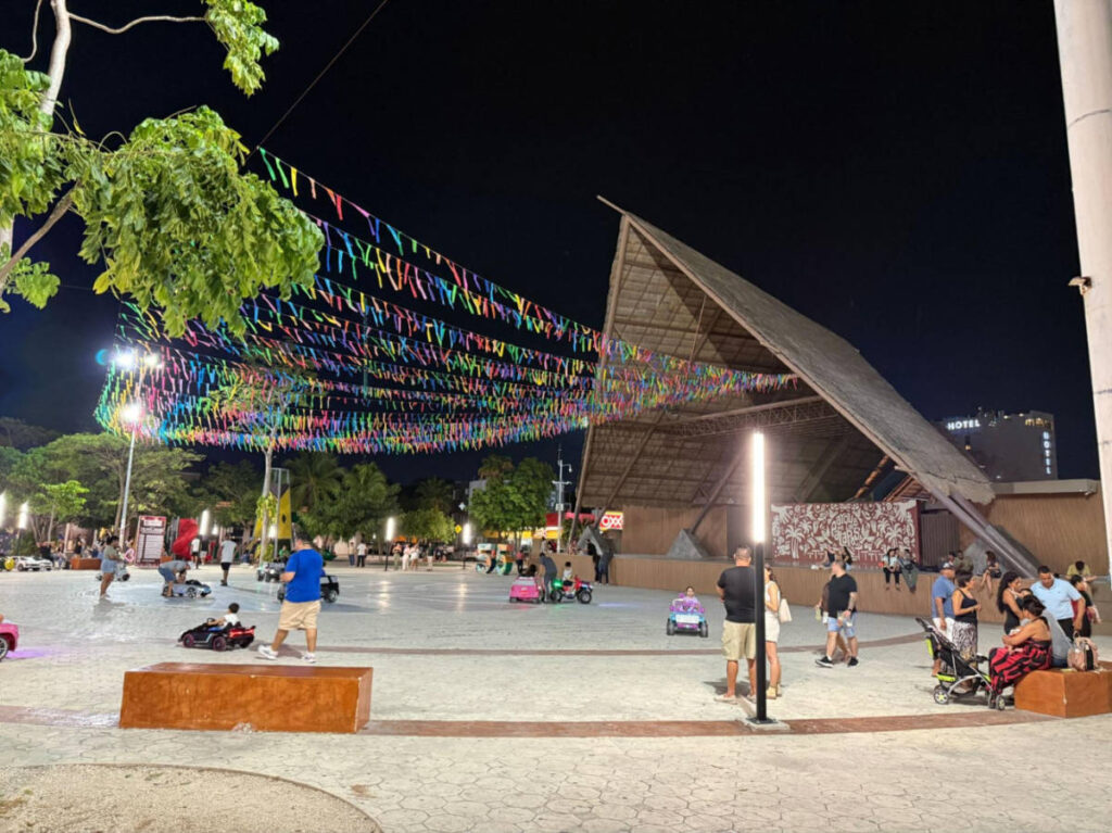 People enjoying at the Parque de las Palapas in El Centro at night