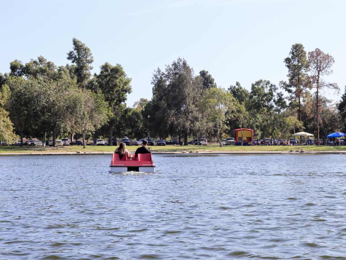 A couple pedal boating during morning in El Dorado Park
