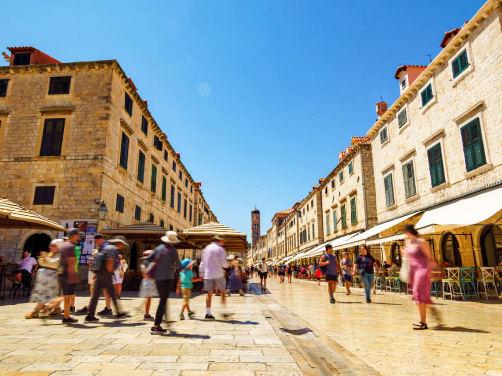 View of the people walking around the town of Dubrovnik on a sunny day
